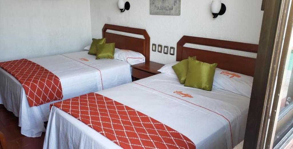 Postel nebo postele na pokoji v ubytování Hotel Candilejas Playa