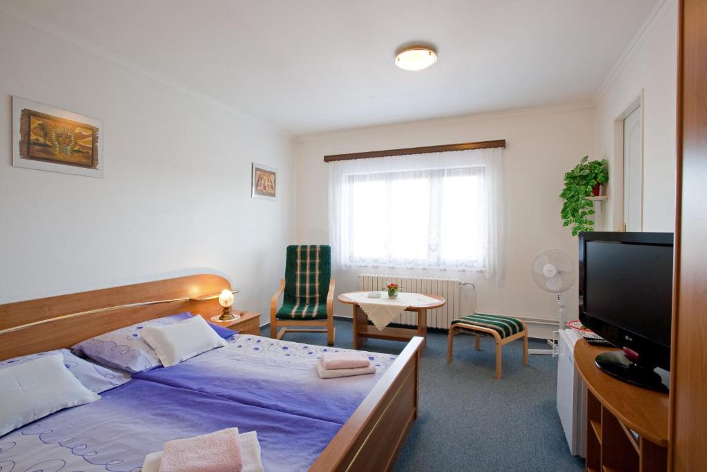 Postel nebo postele na pokoji v ubytování Pension Minor