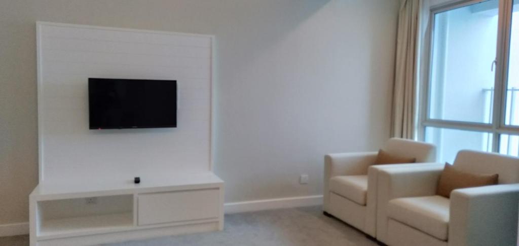 TV a/nebo společenská místnost v ubytování UTM Hotel & Residence