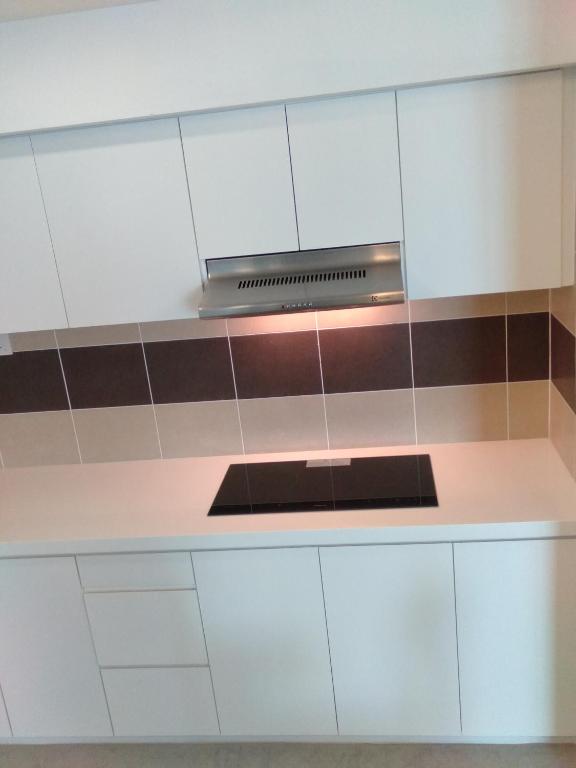 Kuchyň nebo kuchyňský kout v ubytování UTM Hotel & Residence