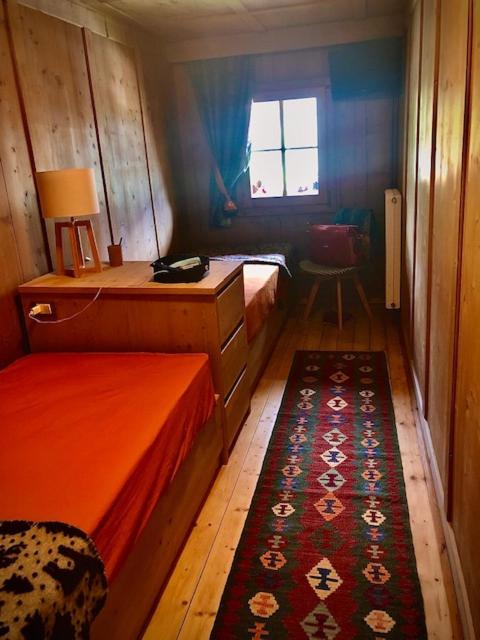 A bed or beds in a room at Chalet Sappada