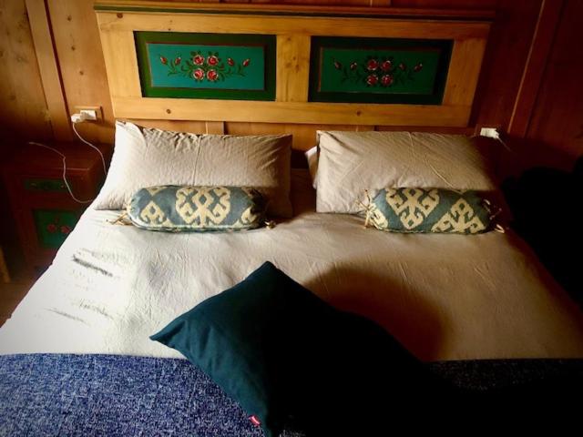 A bed or beds in a room at Chalet Sappada