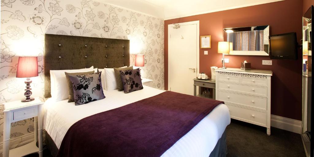 Postel nebo postele na pokoji v ubytování The Hideaway At Windermere (Adults only)