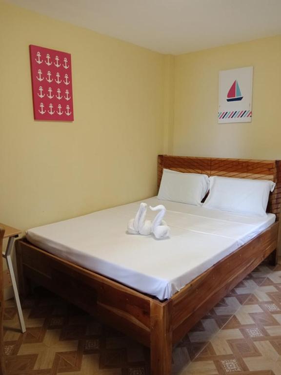 Postel nebo postele na pokoji v ubytování Ralphseej Pension House