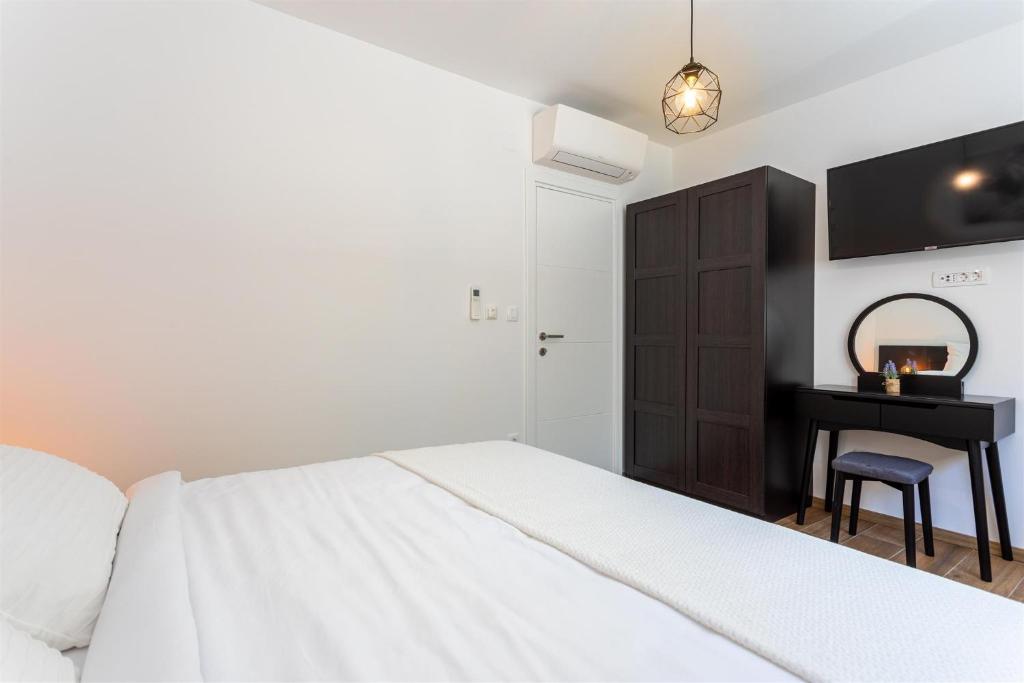Łóżko lub łóżka w pokoju w obiekcie Villa Manhattan