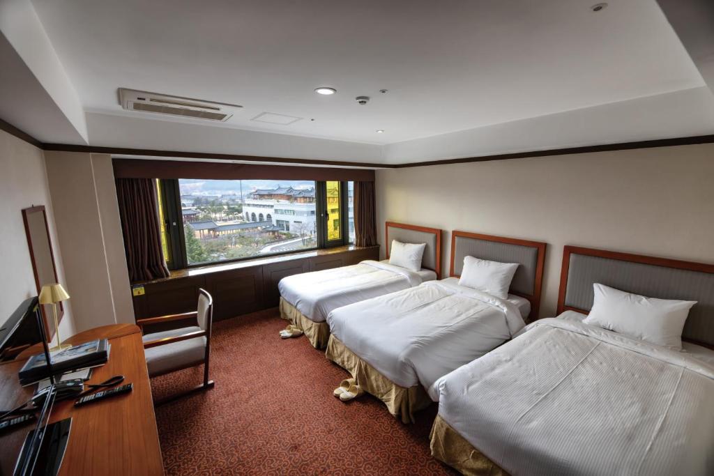 Postel nebo postele na pokoji v ubytování The K Hotel Gyeongju