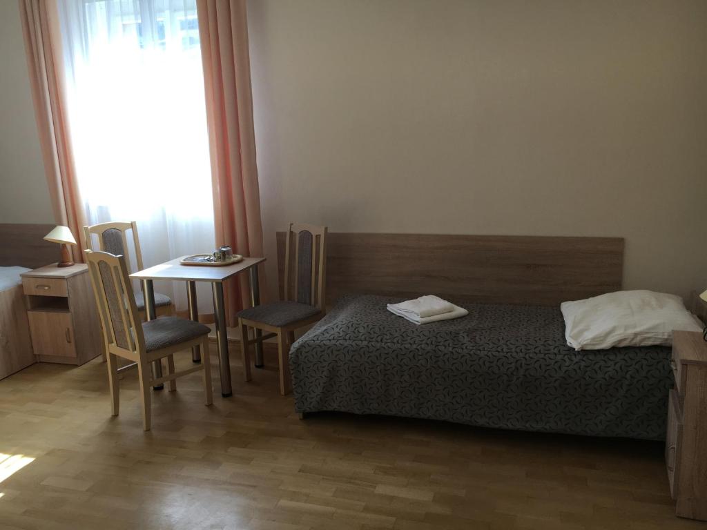 Posteľ alebo postele v izbe v ubytovaní Stary Dom Zdrojowy