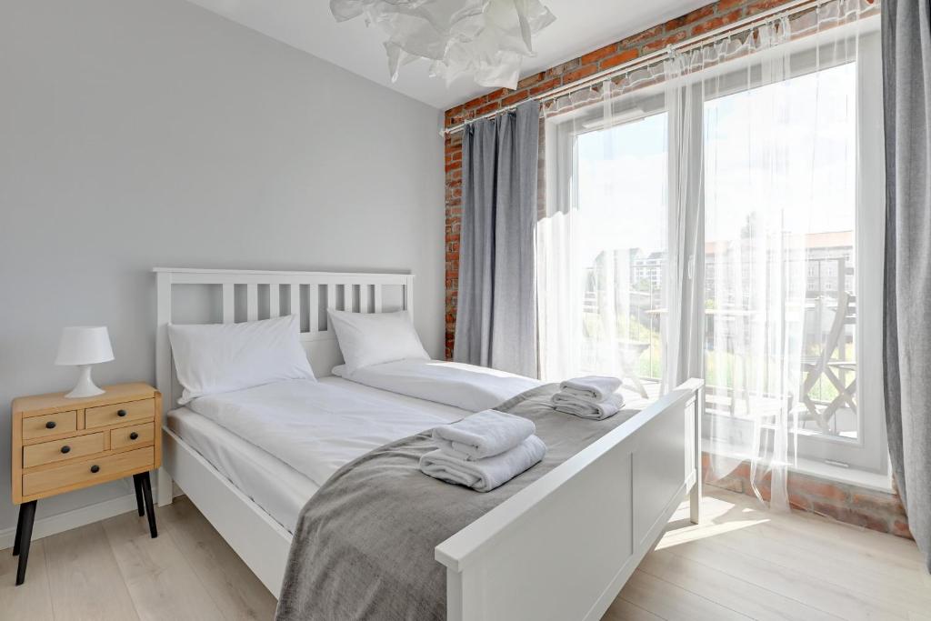 Łóżko lub łóżka w pokoju w obiekcie GRANO APARTMENTS Gdańsk Old Town SPA & Wellness - GRANO APARTMENTS Gdańsk Residence SPA & Wellness