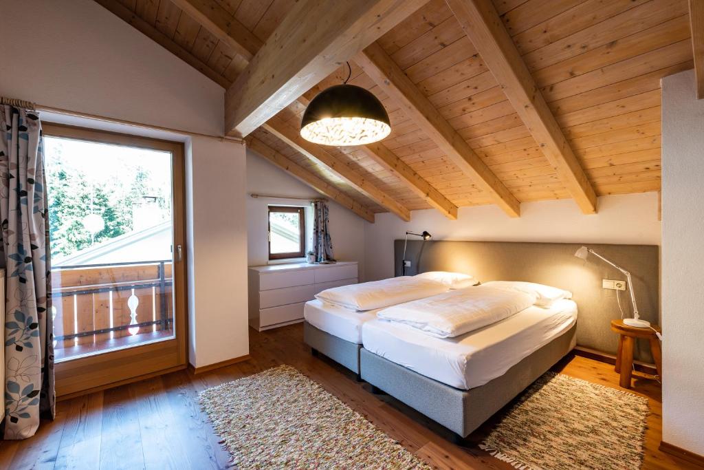 Postel nebo postele na pokoji v ubytování Apartment Stifter