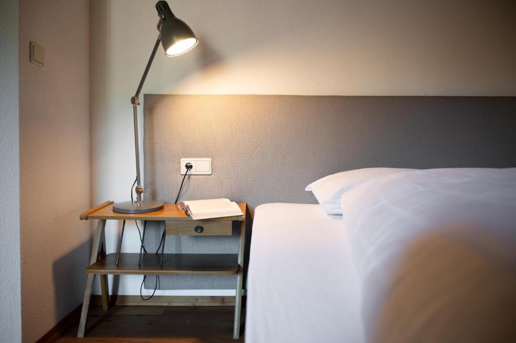 Postel nebo postele na pokoji v ubytování Apartment Stifter