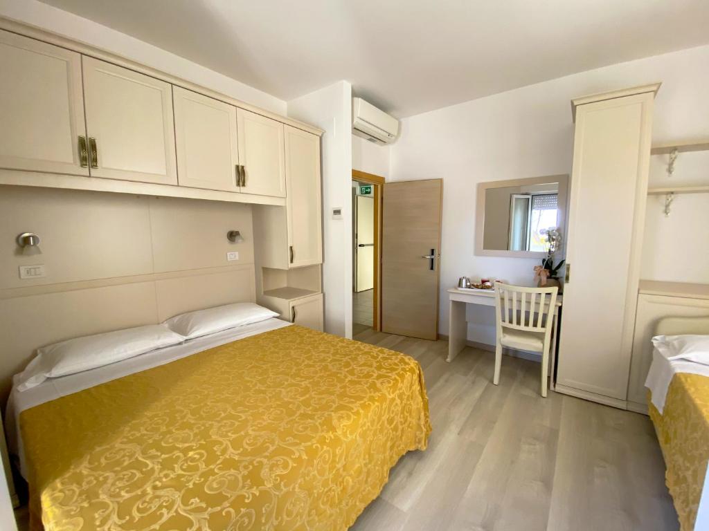 Postel nebo postele na pokoji v ubytování Albergo Villa Aida