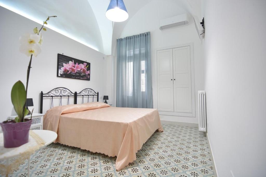 A bed or beds in a room at Lu Trisciulu