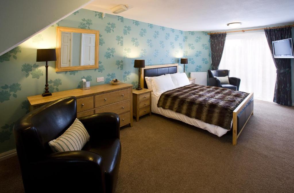 Postel nebo postele na pokoji v ubytování The Hideaway At Windermere (Adults only)