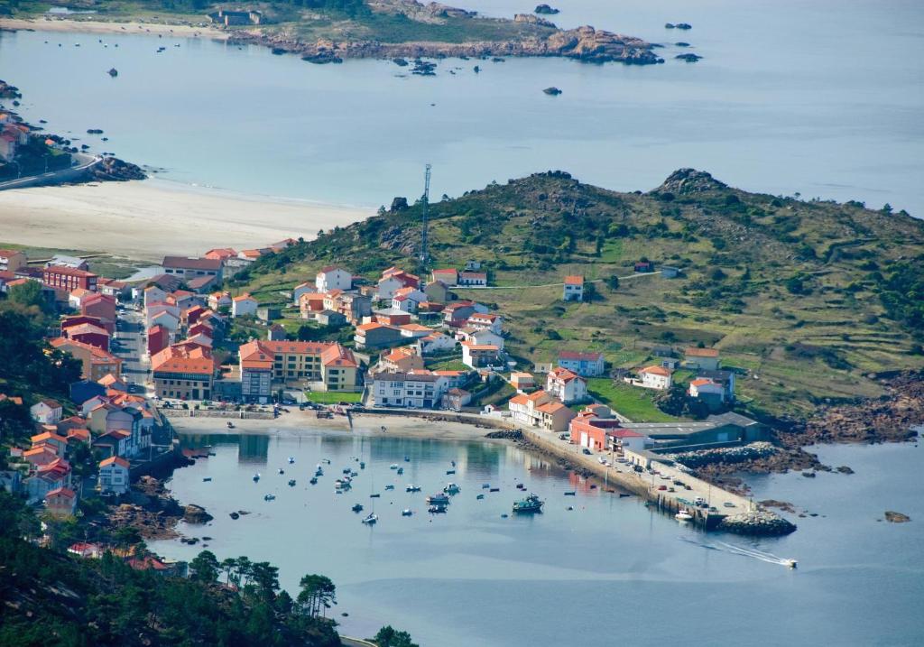 an aerial view of a town with boats in a harbor at Apartamentos Olimpo Celta-Apart Laura in O Pindo