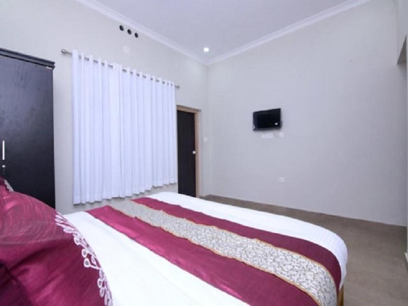 Postel nebo postele na pokoji v ubytování Wayal Wayanad Farm Resort