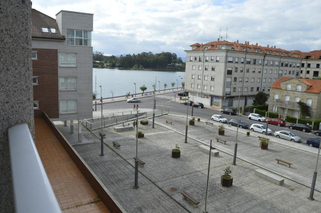 arial view of a city with a parking lot at Apartamento con vistas en Cambados in Cambados