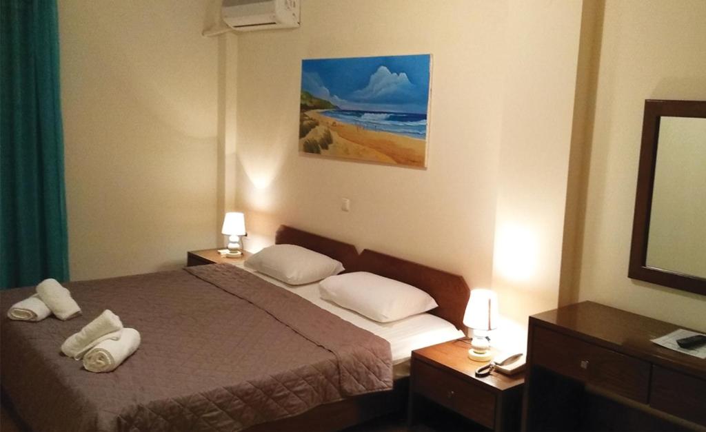 Un ou plusieurs lits dans un hébergement de l'établissement Hotel Arethousa