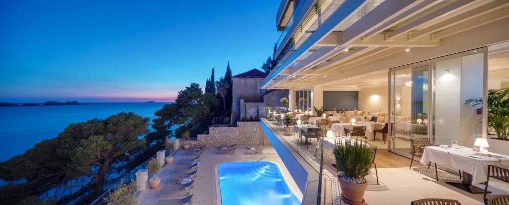 a view of a building with a swimming pool at Hotel More in Dubrovnik