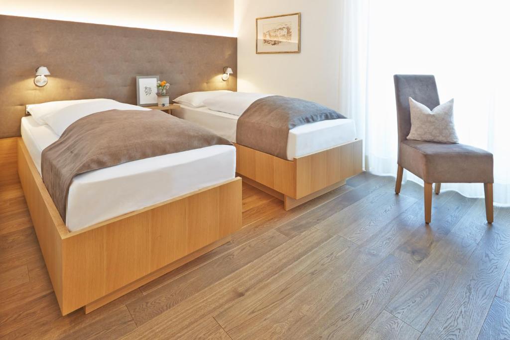Posteľ alebo postele v izbe v ubytovaní Hotel Post Gries