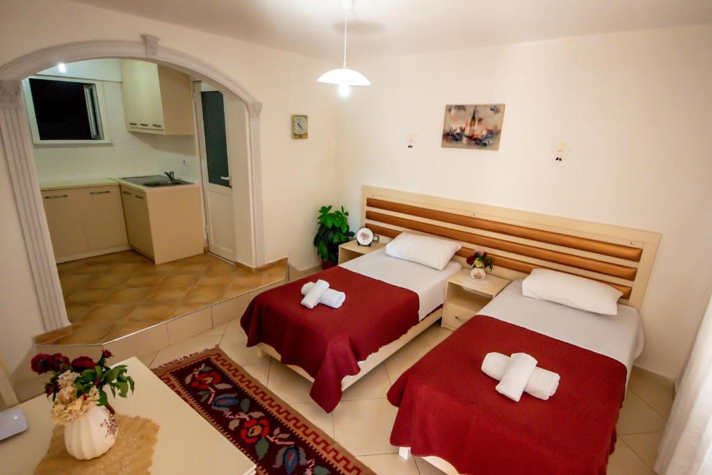 Łóżko lub łóżka w pokoju w obiekcie Guest House Garden