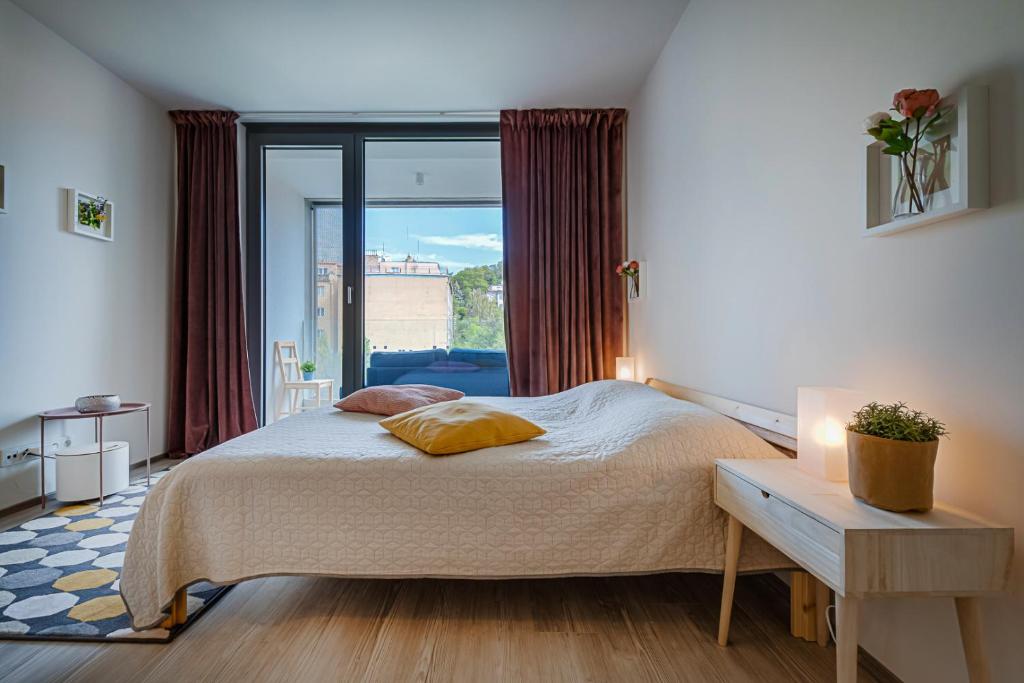 Postel nebo postele na pokoji v ubytování Homy Apartments