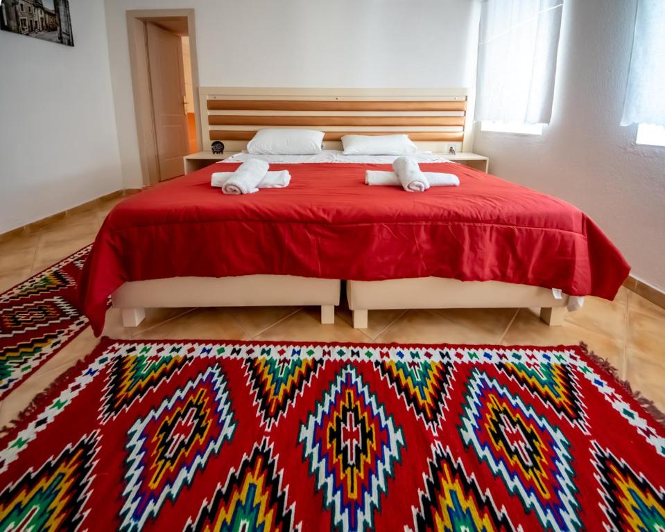 Łóżko lub łóżka w pokoju w obiekcie Guest House Garden