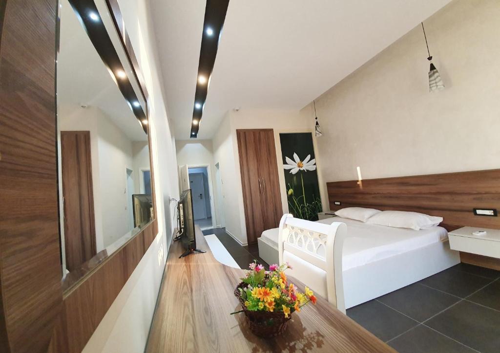 A bed or beds in a room at Hotel Kamomil