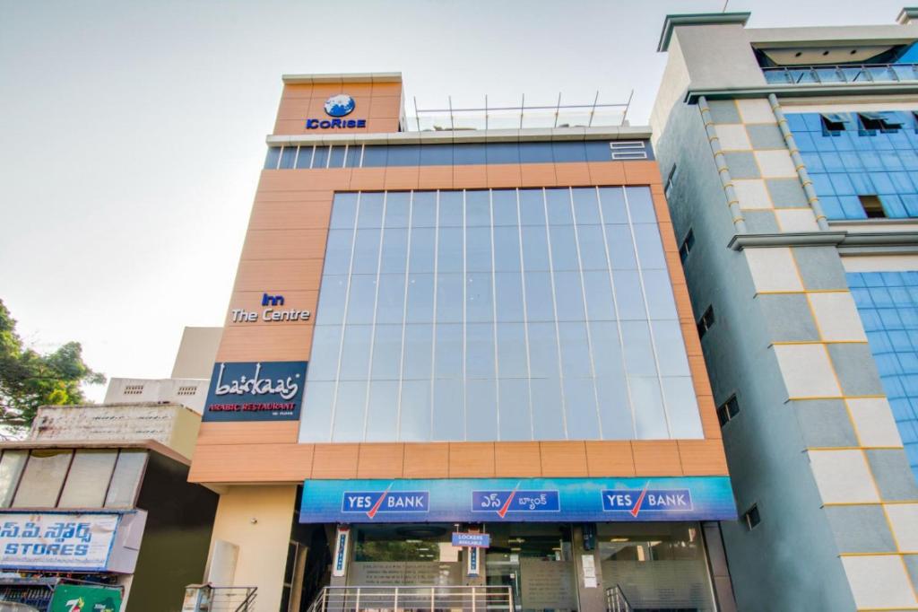 a building with a clock on top of it at INN THE CENTRE in Nellore