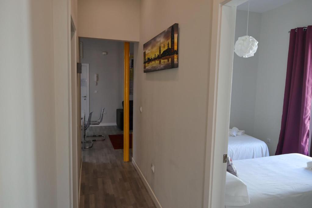 Postel nebo postele na pokoji v ubytování Triana Suite Dreams