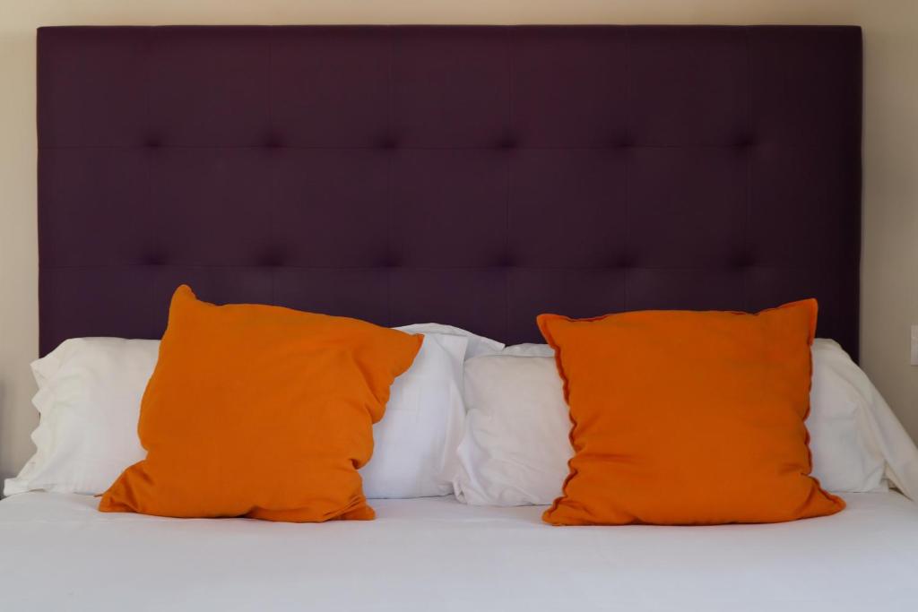 Postel nebo postele na pokoji v ubytování Triana Suite Dreams
