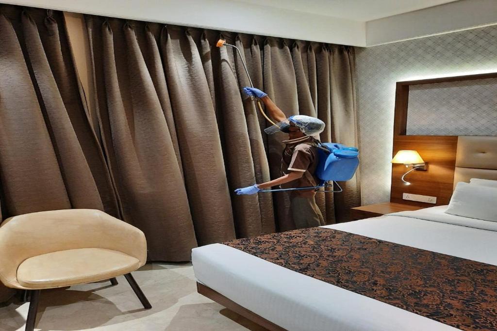 Postel nebo postele na pokoji v ubytování Hotel Radiance