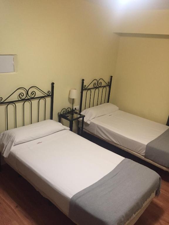 Cama o camas de una habitación en Hospedería Luis de Góngora