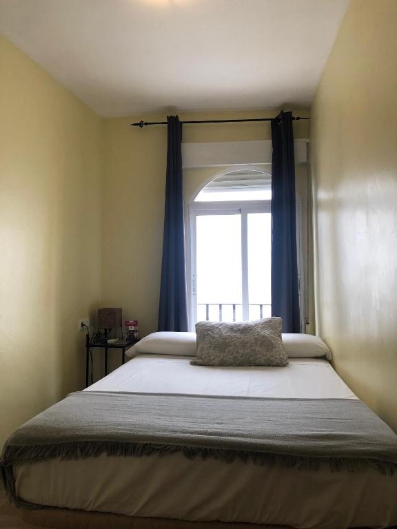 Cama o camas de una habitación en Hospedería Luis de Góngora