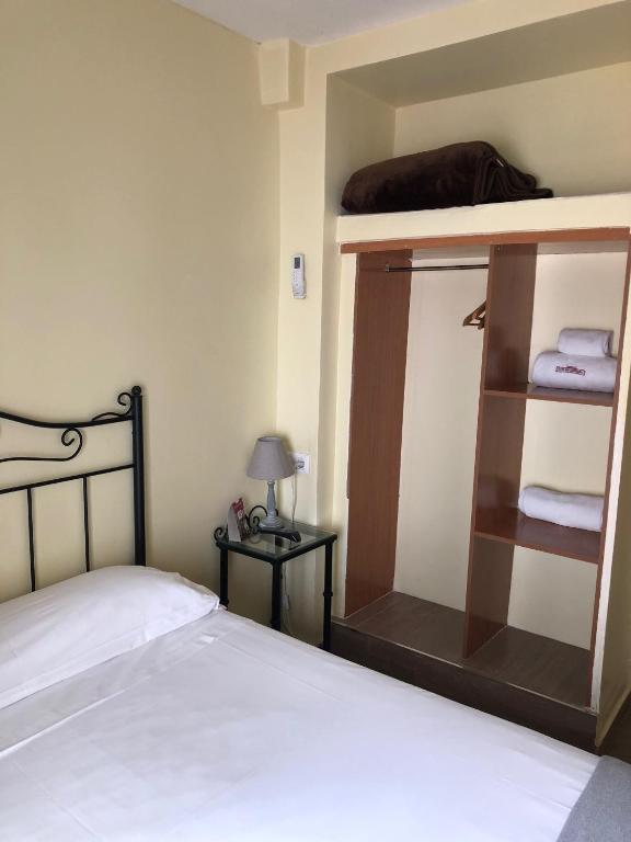 Cama o camas de una habitación en Hospedería Luis de Góngora