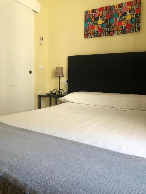 Cama o camas de una habitación en Hospedería Luis de Góngora