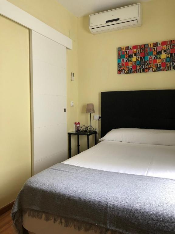 Cama o camas de una habitación en Hospedería Luis de Góngora