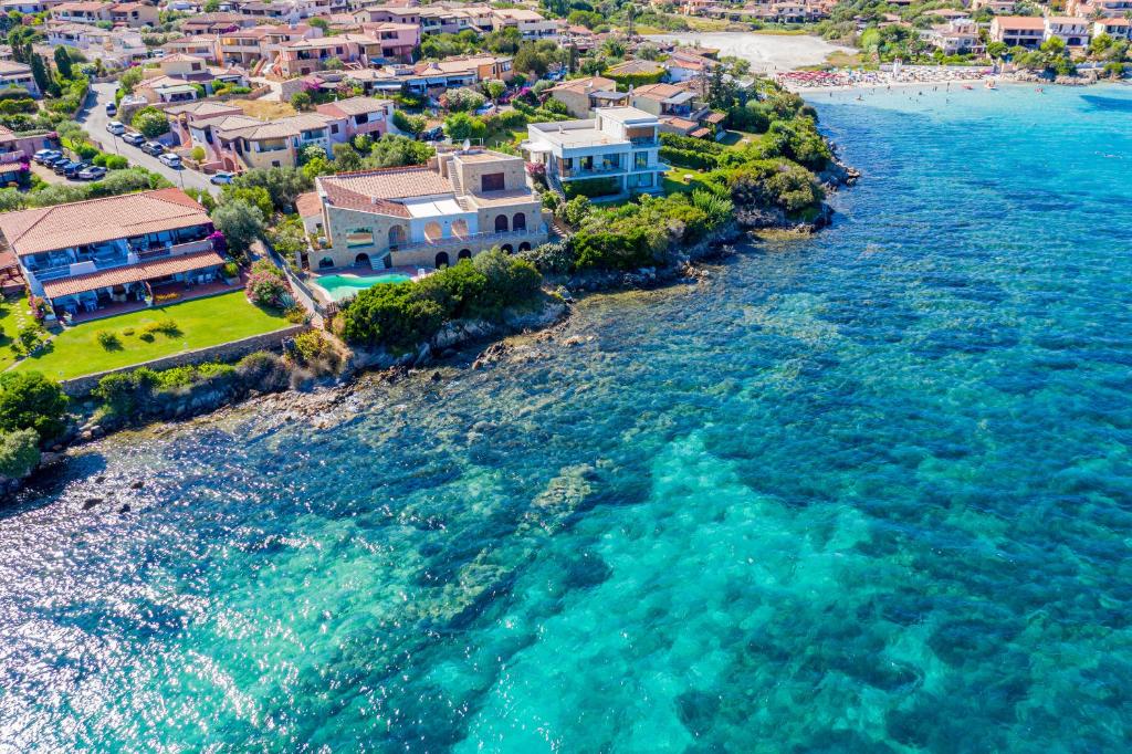 an aerial view of a beach with houses and the water at Casa Leda in Golfo Aranci