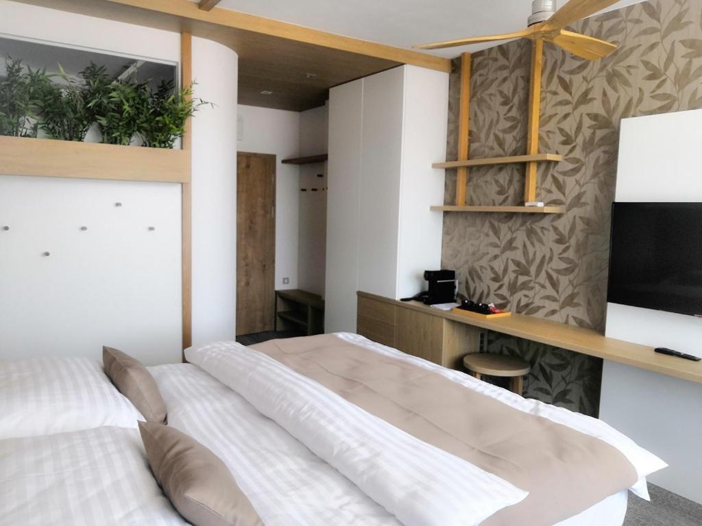 Postel nebo postele na pokoji v ubytování Hotel Adamantino