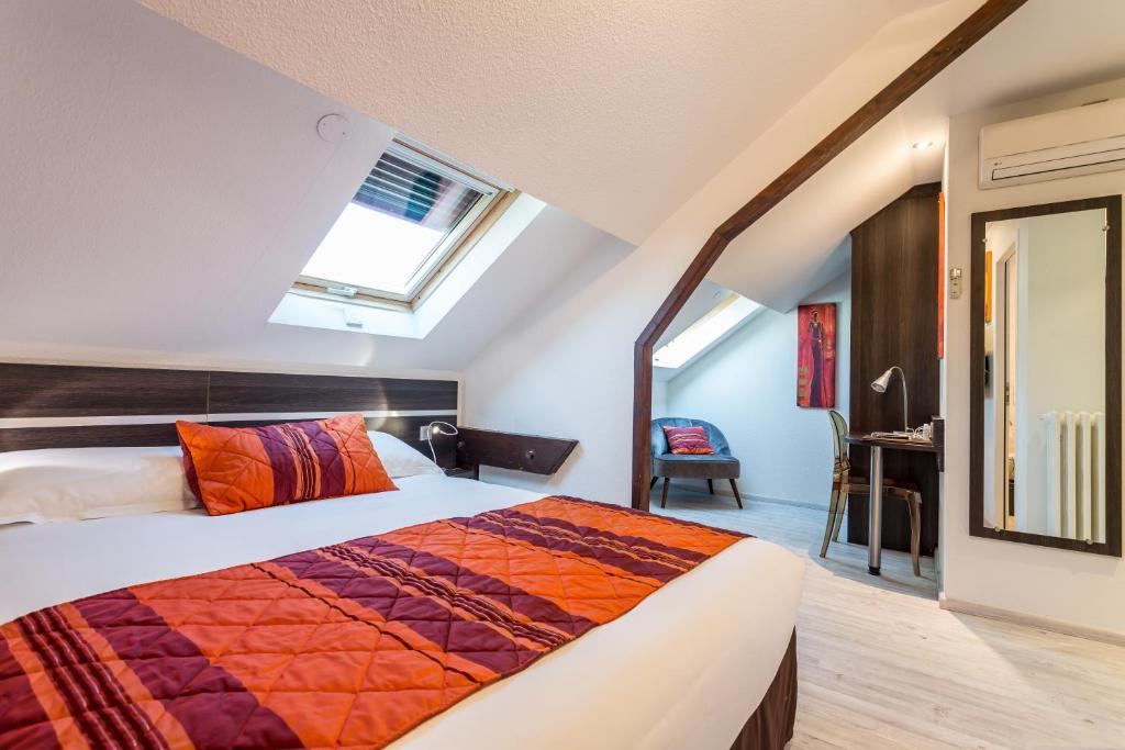 Postel nebo postele na pokoji v ubytování Hotel Le Centre
