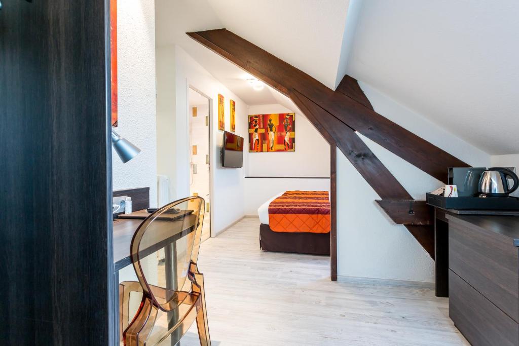 Postel nebo postele na pokoji v ubytování Hotel Le Centre