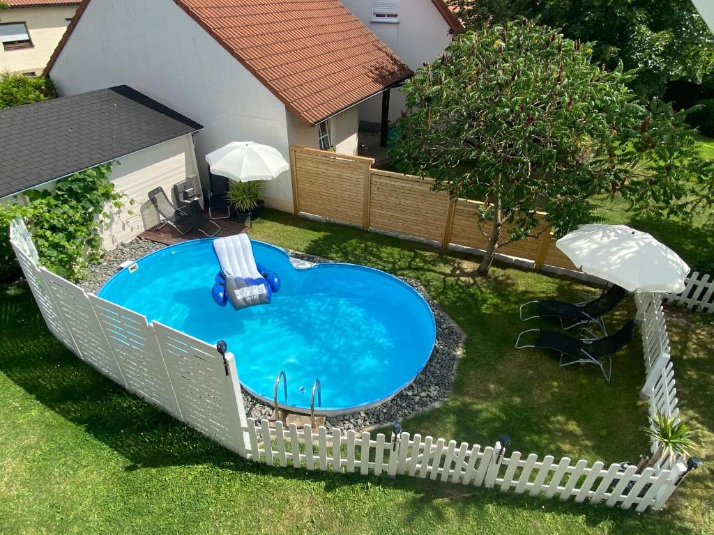 an overhead view of a swimming pool in a yard at Frankenwaldwohnung in Stockheim Oberfranken