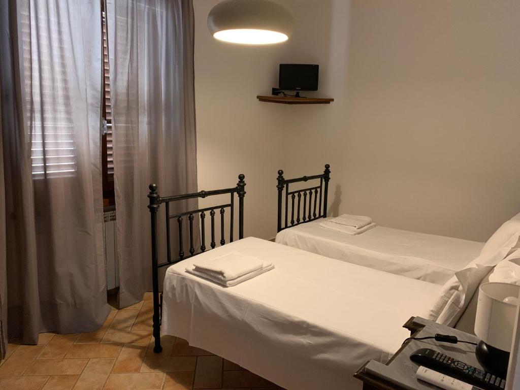 Posteľ alebo postele v izbe v ubytovaní B&B La Loccaia