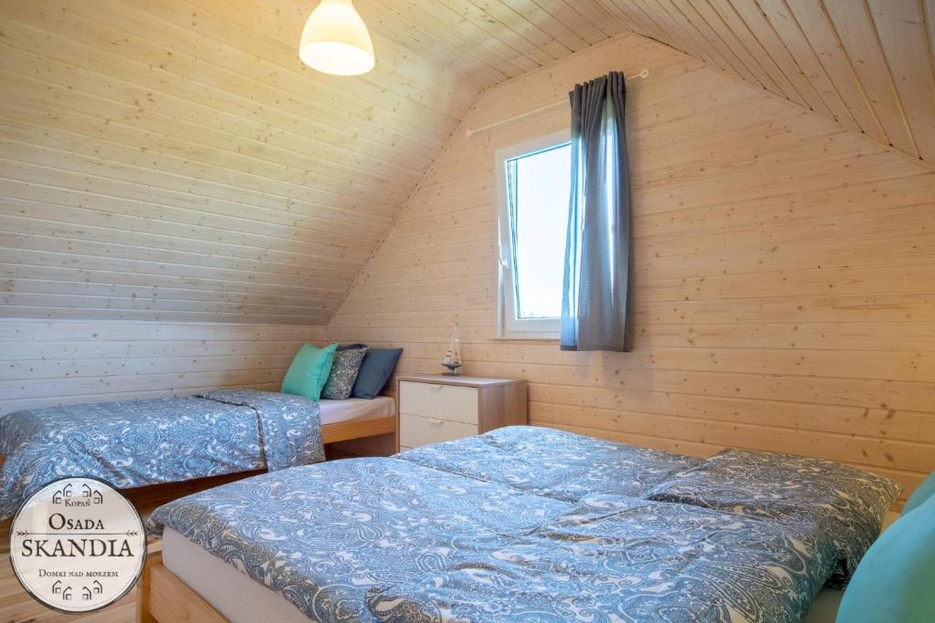 Postel nebo postele na pokoji v ubytování Osada Skandia Kopań