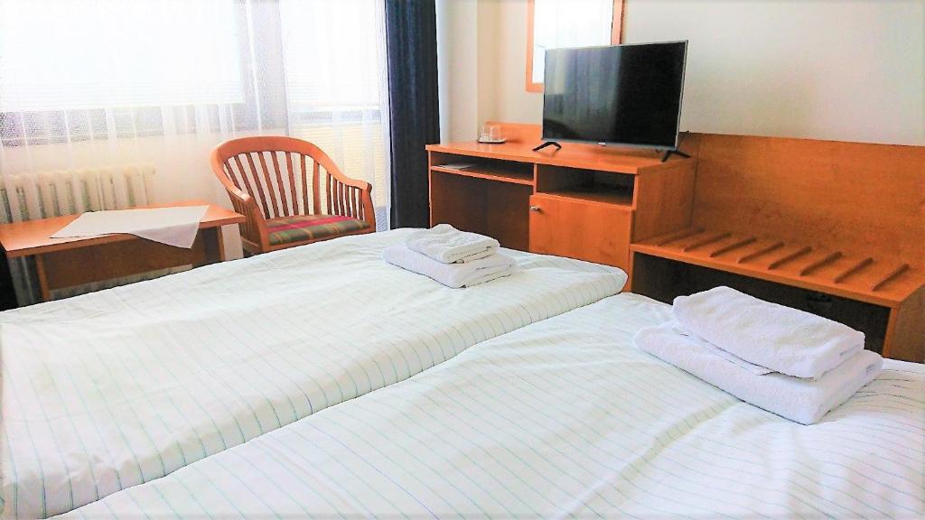 Postel nebo postele na pokoji v ubytování Hotel Adamantino