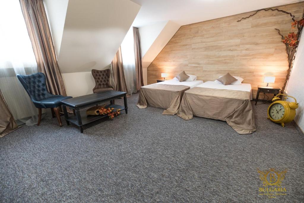 Un pat sau paturi într-o cameră la Wellness Hotel Bulgaria