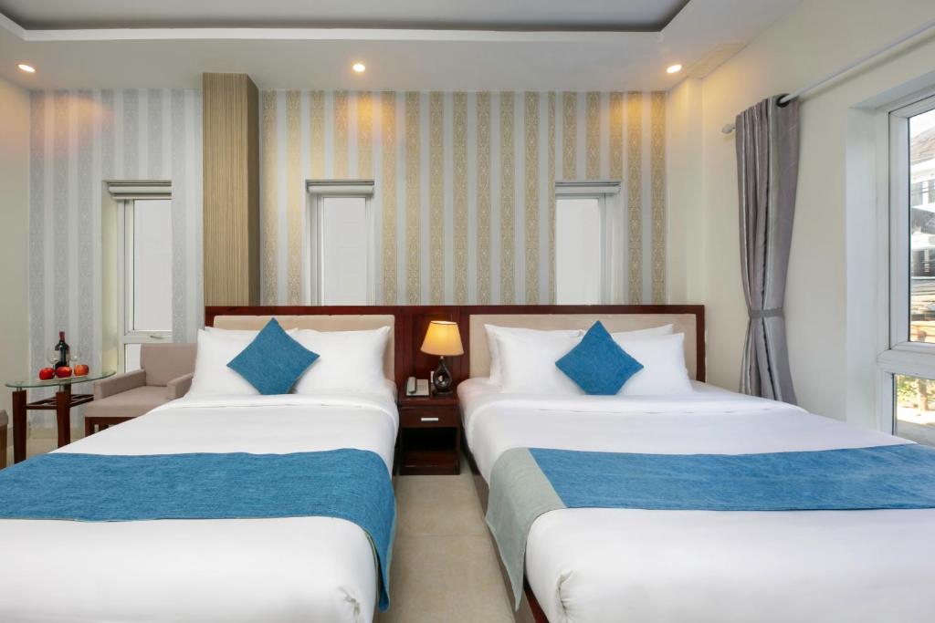 Postel nebo postele na pokoji v ubytování Gio Bien 2 Hotel by THG