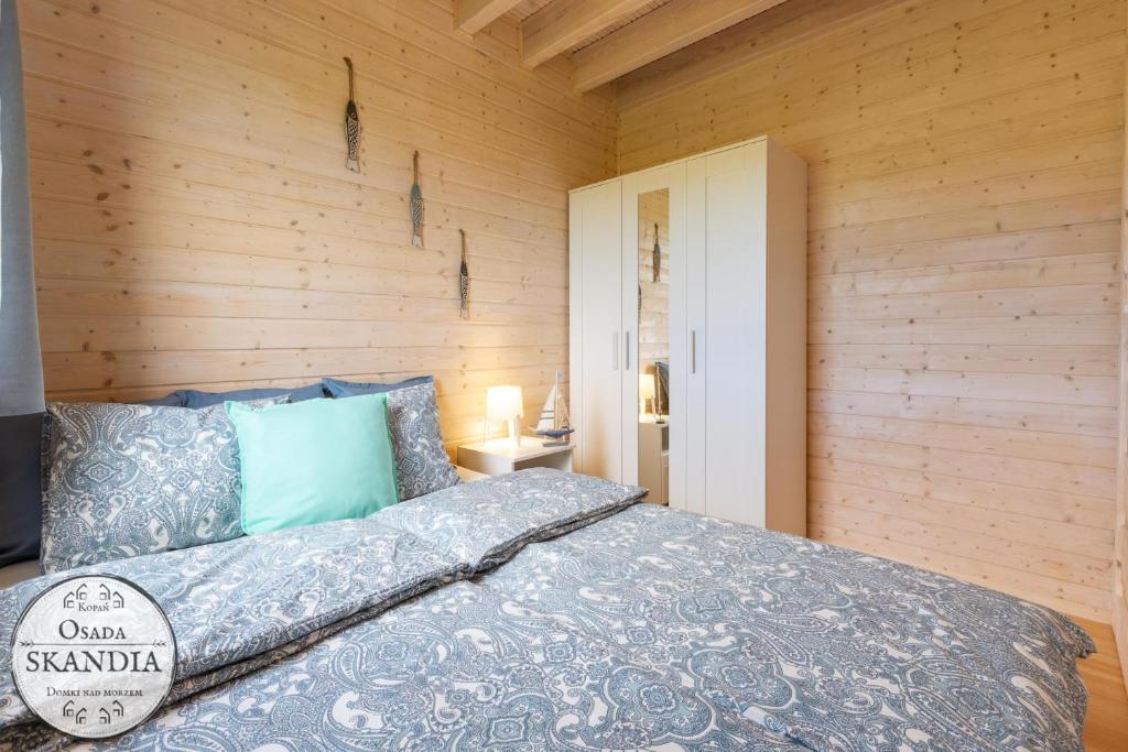 Postel nebo postele na pokoji v ubytování Osada Skandia Kopań