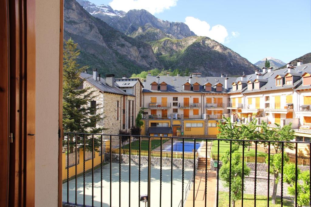 a view from a balcony of buildings and mountains at Ribagorza in Benasque