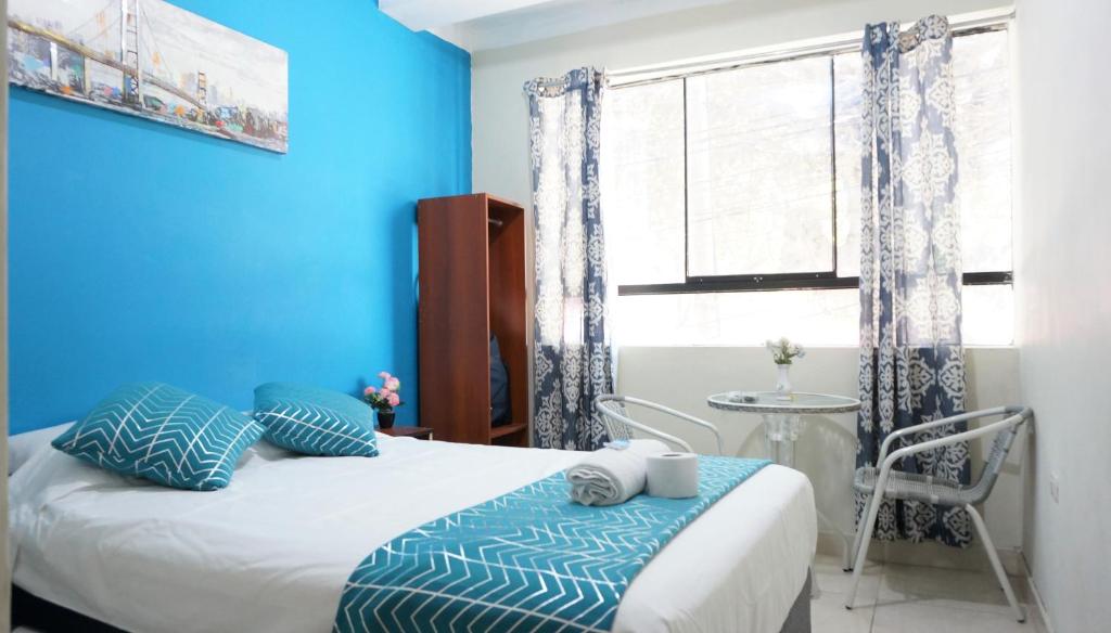 Postel nebo postele na pokoji v ubytování AYPA Hostal