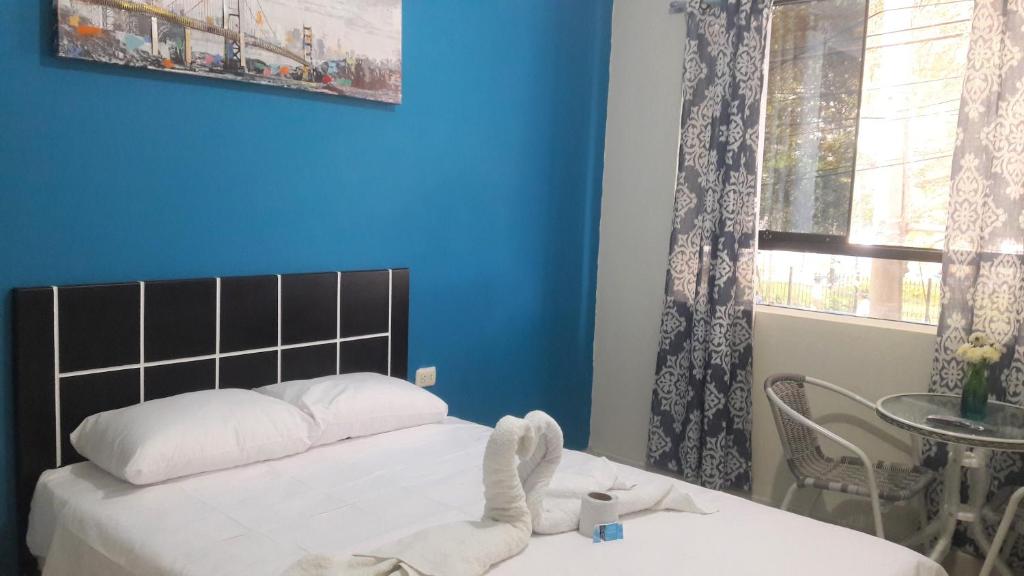 Postel nebo postele na pokoji v ubytování AYPA Hostal